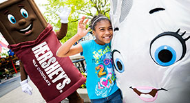 Girl and Hershey's Kiss character playing at Hersheypark