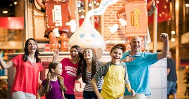Family interacting at Hershey's Chocolate World
