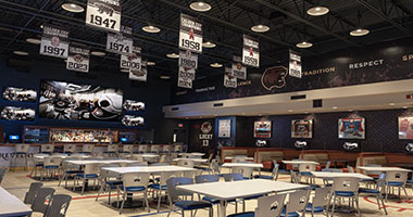 big screen tv and seating at The Bears' Den inside Hershey Lodge