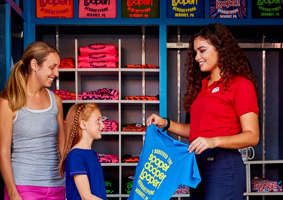 Family purchasing T-shirt at Hersheypark retail kiosk