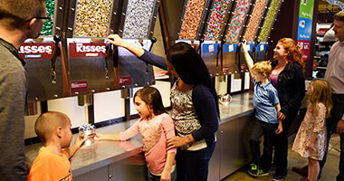Family interacting at Hershey's Largest Candy Store